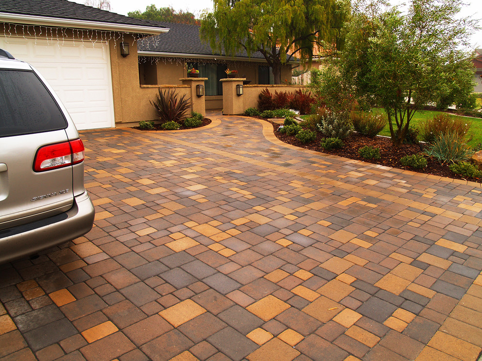 Photo of a mediterranean front yard patio in Santa Barbara with concrete pavers.