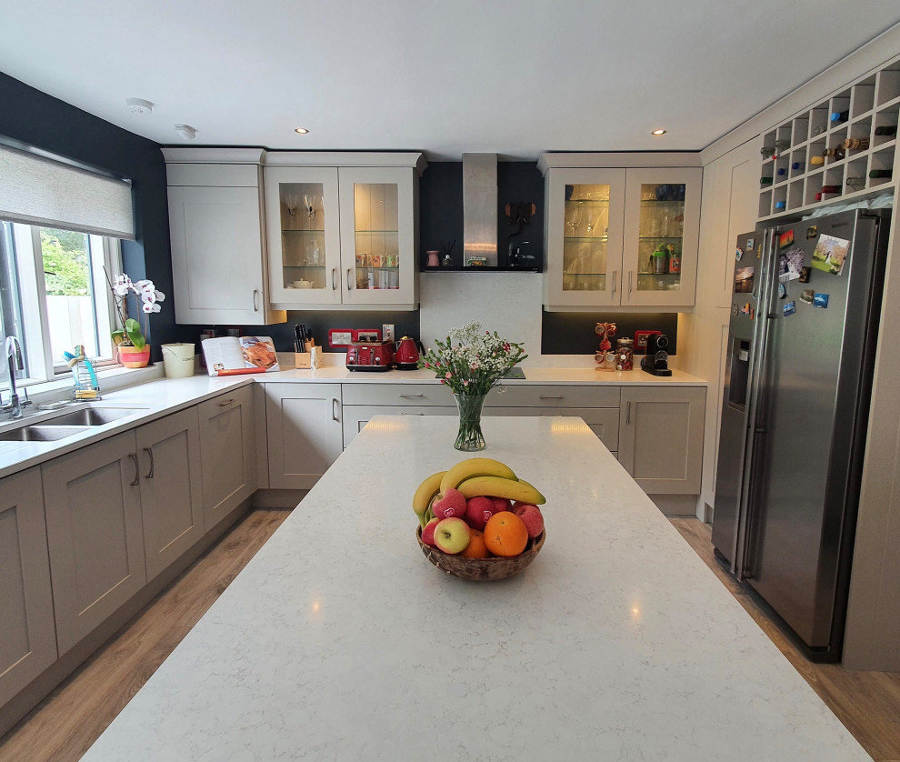 Inspiration for a large modern open plan kitchen in Dublin with shaker cabinets, grey cabinets and with island.