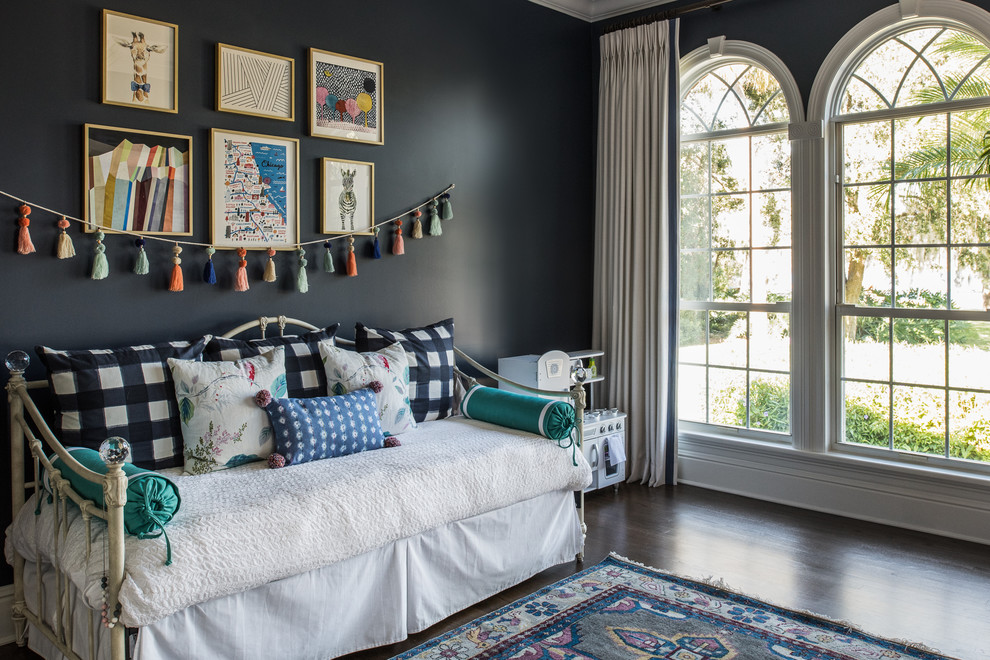 Design ideas for a traditional kids' bedroom for girls in Tampa with black walls and dark hardwood floors.