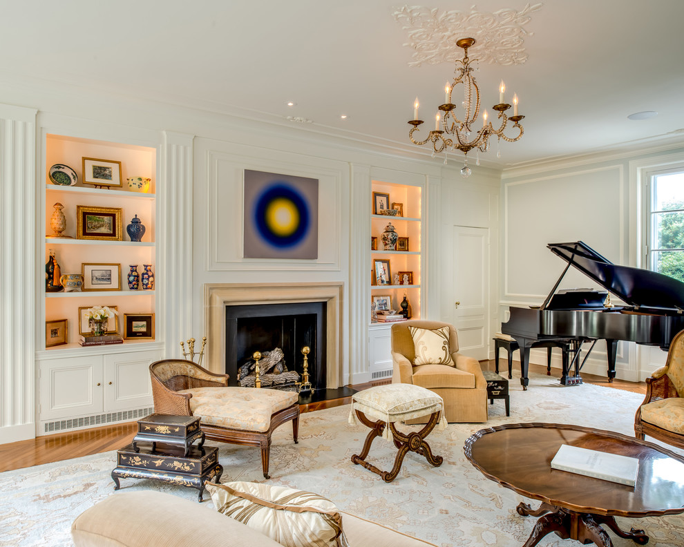 Inspiration for a large traditional enclosed living room in Philadelphia with a music area, beige walls, medium hardwood floors, a standard fireplace, a stone fireplace surround and no tv.