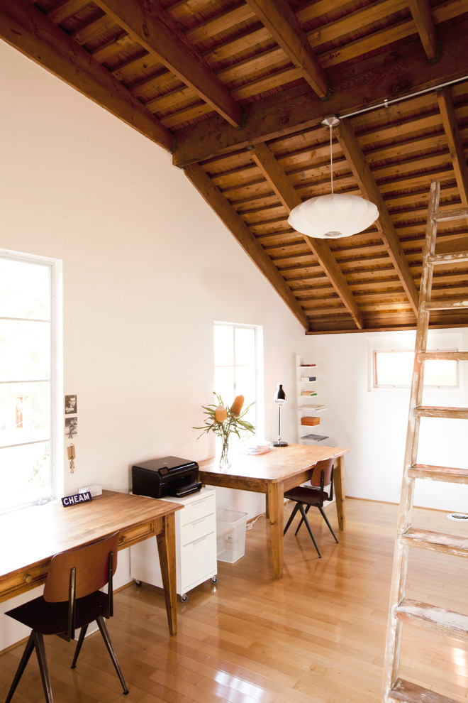 This is an example of a country home office in Los Angeles with white walls.