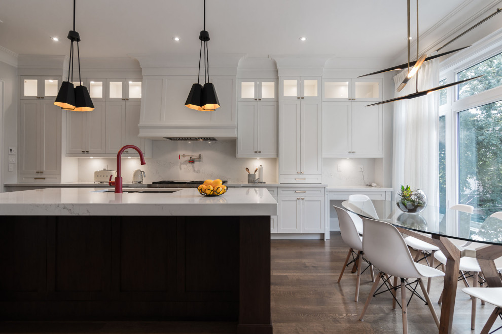 Inspiration for a large transitional l-shaped kitchen pantry in Toronto with a double-bowl sink, shaker cabinets, white cabinets, quartz benchtops, yellow splashback, engineered quartz splashback, panelled appliances, dark hardwood floors, blue floor, white benchtop and with island.