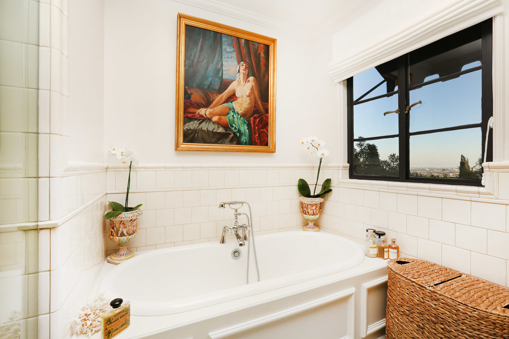 Inspiration for a large traditional master bathroom in Los Angeles with furniture-like cabinets, white cabinets, a corner tub, a corner shower, a one-piece toilet, beige tile, beige walls, mosaic tile floors, a drop-in sink, marble benchtops, beige floor and a hinged shower door.