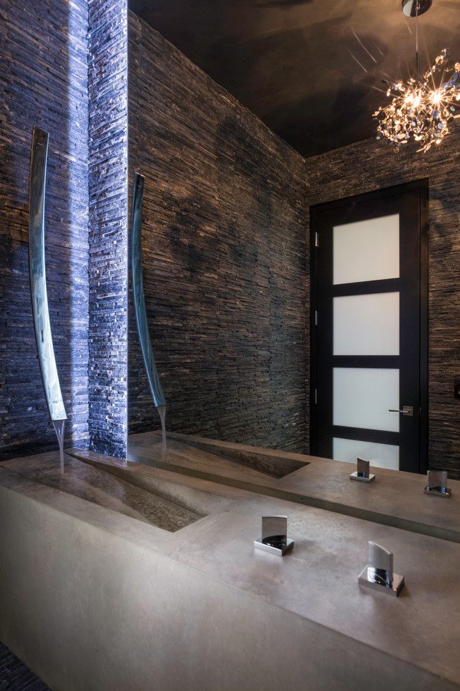 Mid-sized modern 3/4 bathroom in Boise with furniture-like cabinets, black cabinets, black tile, stone tile, black walls, an integrated sink and concrete benchtops.