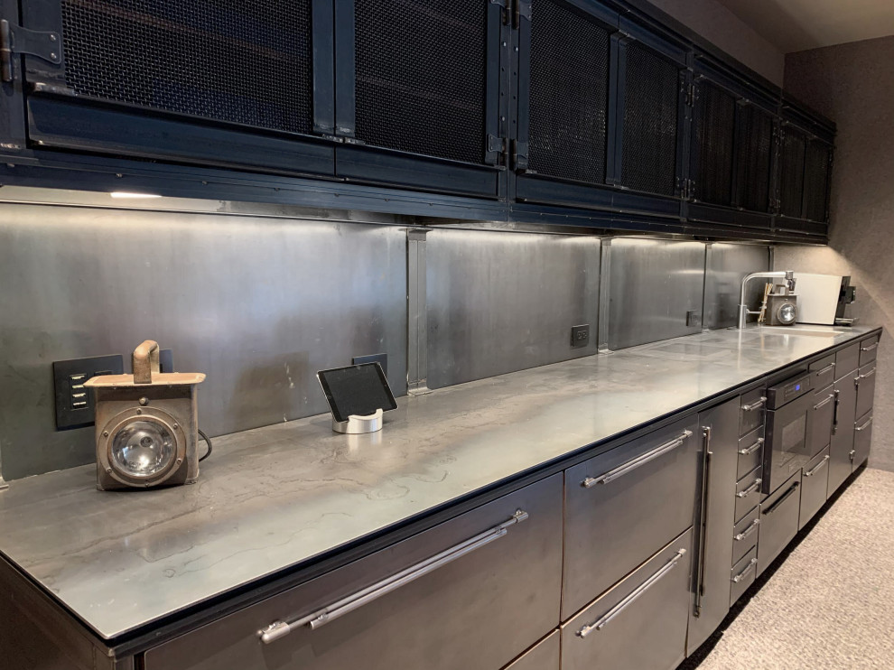Wet bar - large industrial wet bar idea in Chicago with stainless steel countertops