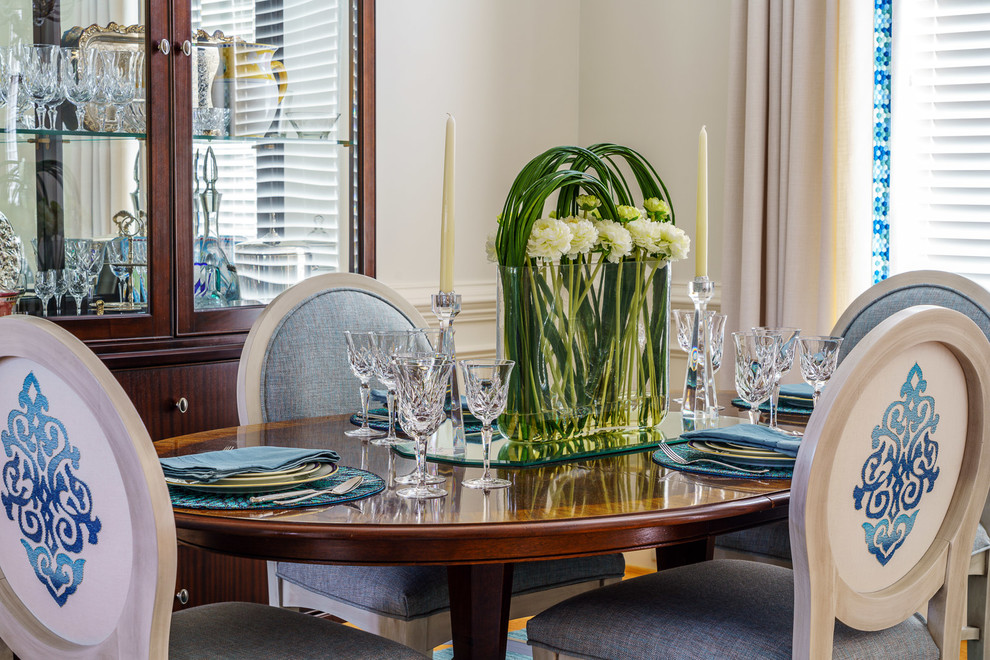 Example of a mid-sized transitional medium tone wood floor and brown floor dining room design with white walls and no fireplace