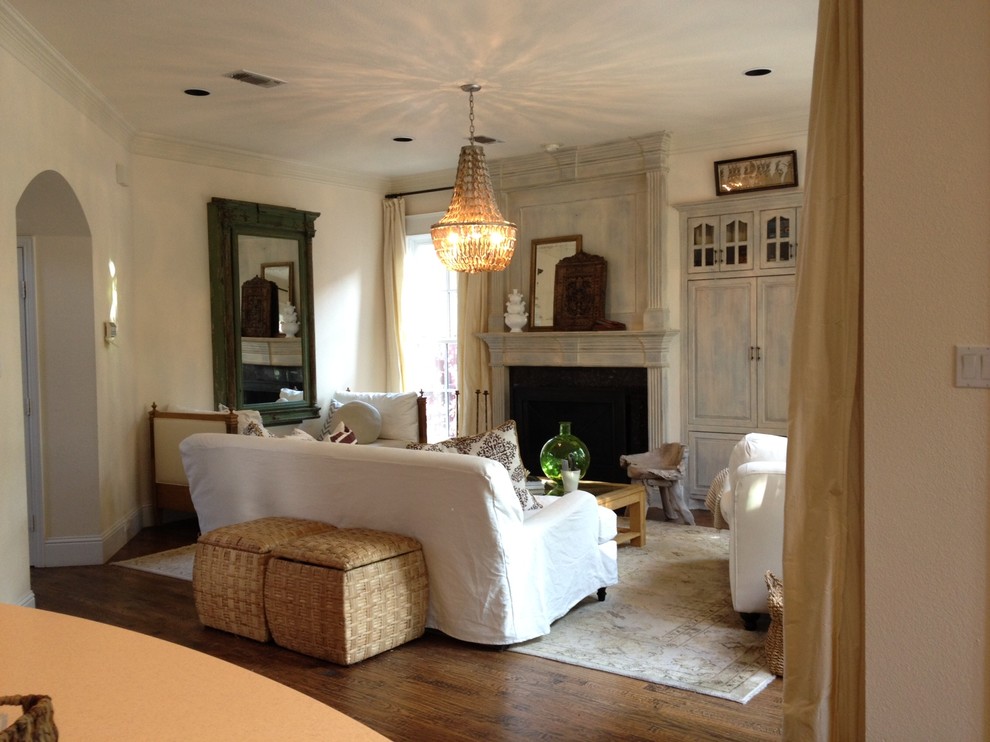 This is an example of a traditional enclosed living room in Dallas with a standard fireplace.