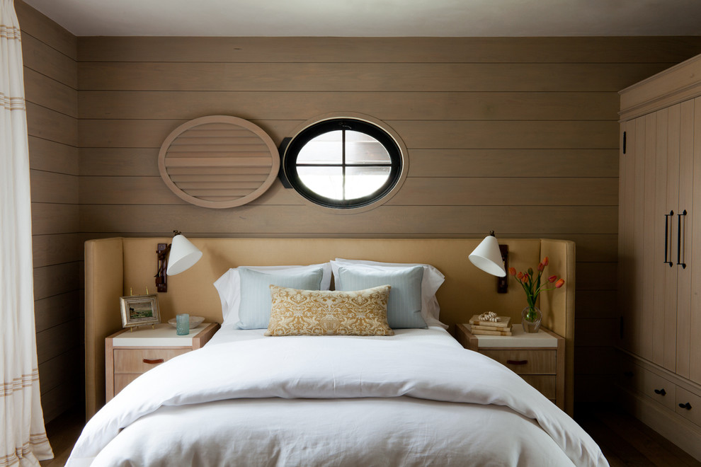 Photo of a mid-sized beach style guest bedroom in Orange County with brown walls.