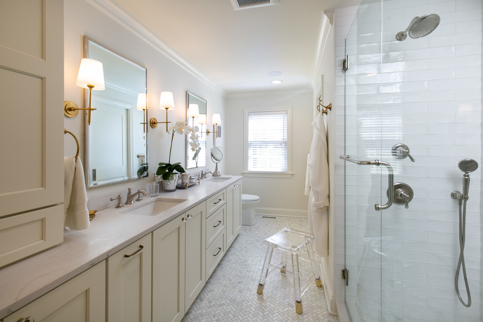 Design ideas for a mid-sized transitional master bathroom in Kansas City with white tile, ceramic tile, white walls, an undermount sink, engineered quartz benchtops, a hinged shower door, white benchtops, recessed-panel cabinets, beige cabinets, mosaic tile floors and white floor.
