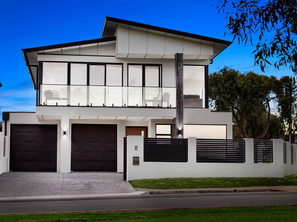 Photo of a contemporary two-storey white exterior in Adelaide.