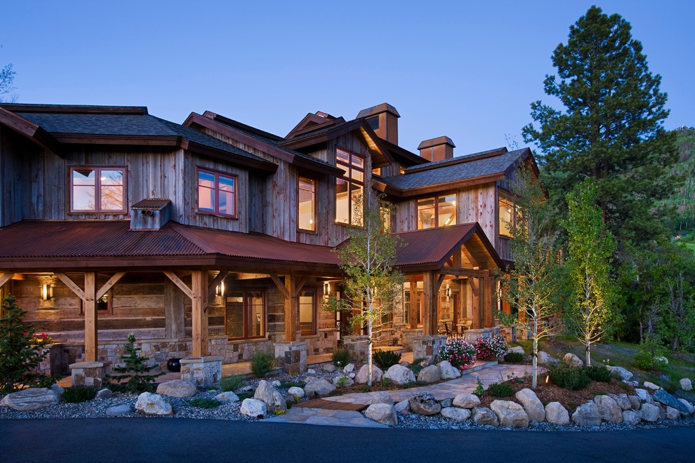 Inspiration for a large country two-storey grey exterior in Denver with mixed siding.