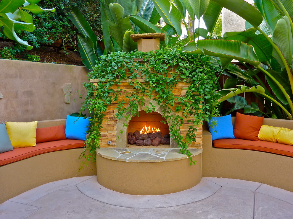 Tropical patio in San Diego with a fire feature.
