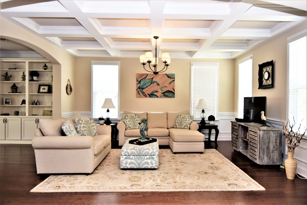 Mid-sized beach style formal open concept living room in Atlanta with beige walls, dark hardwood floors, no fireplace, a freestanding tv and brown floor.
