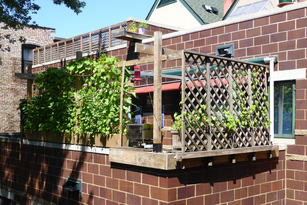 Example of a mountain style privacy balcony design in Toronto with an awning