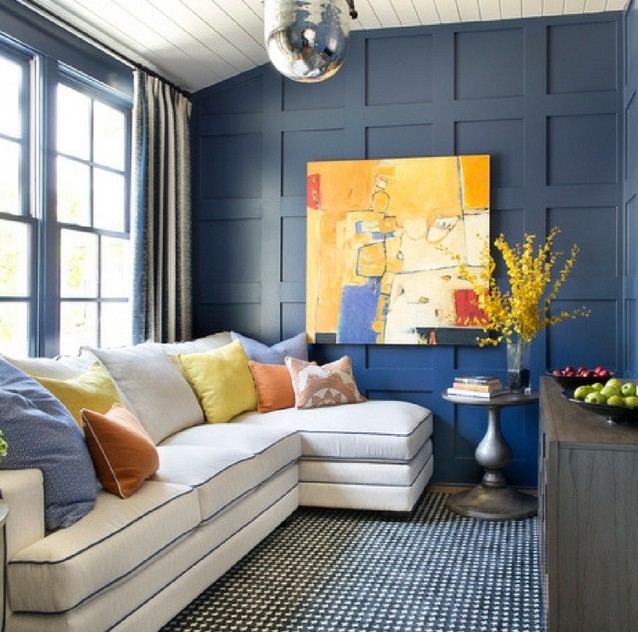 Inspiration for a mid-sized contemporary enclosed family room in Orange County with blue walls, carpet, no fireplace, no tv and multi-coloured floor.