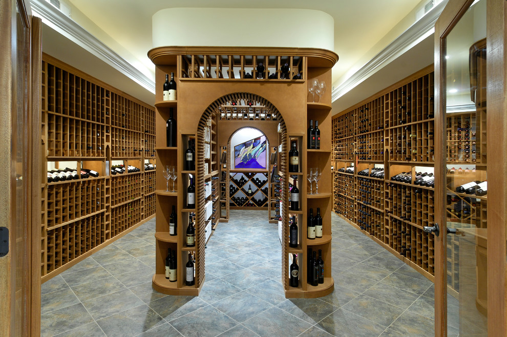 Expansive country wine cellar in DC Metro with slate floors and storage racks.