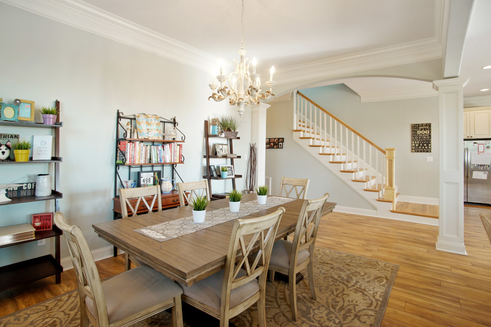 Mid-sized beach style open plan dining in Other with grey walls and medium hardwood floors.