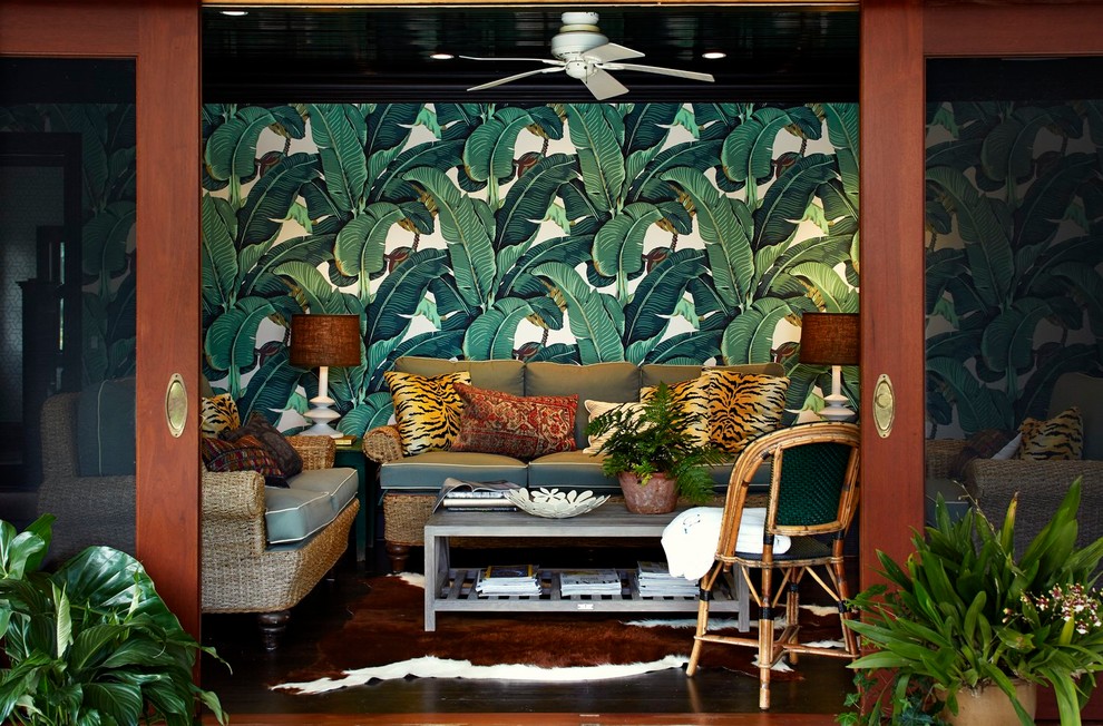 This is an example of a tropical living room in New York with multi-coloured walls.