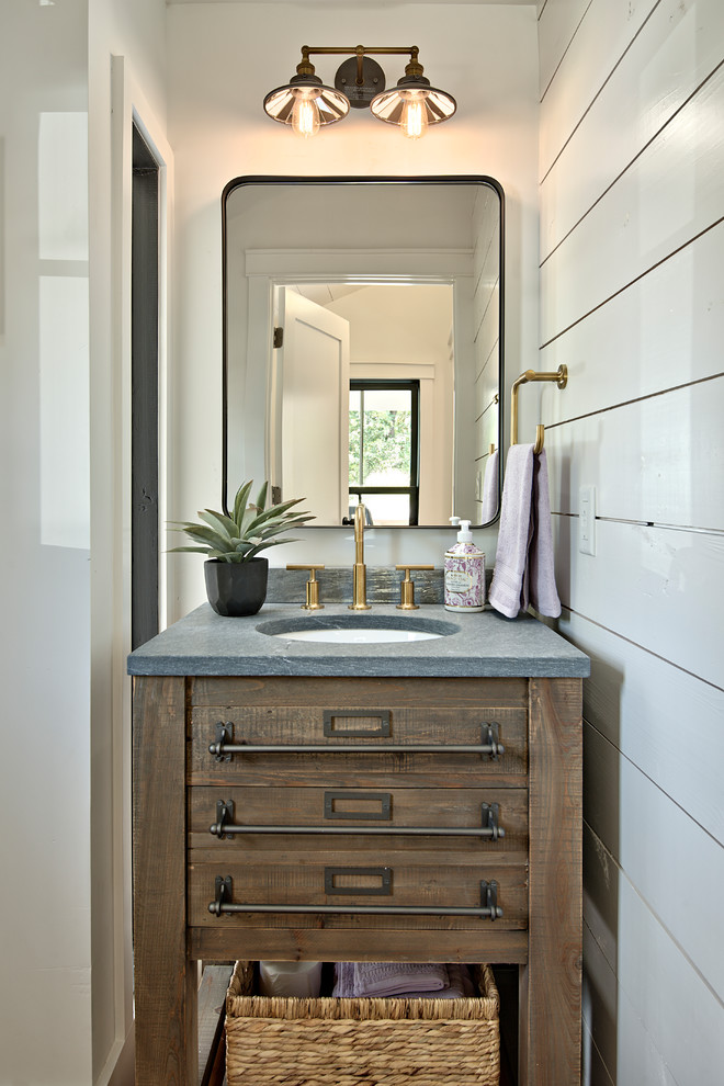 Design ideas for a small country powder room in Austin with furniture-like cabinets, dark wood cabinets, white walls, an undermount sink and grey benchtops.