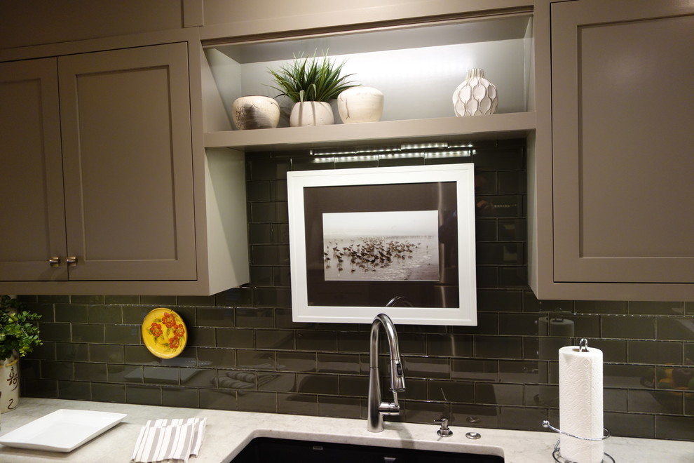 Example of a small transitional u-shaped ceramic tile home design design with an undermount sink, shaker cabinets, gray cabinets, quartz countertops, gray backsplash, glass tile backsplash, stainless steel appliances and a peninsula
