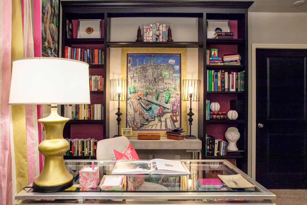 This is an example of a mid-sized eclectic study room in Charleston with beige walls, carpet and a freestanding desk.