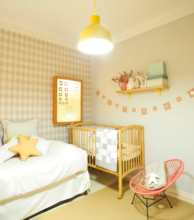 Design ideas for a mid-sized scandinavian kids' room for girls in Barcelona with blue walls.