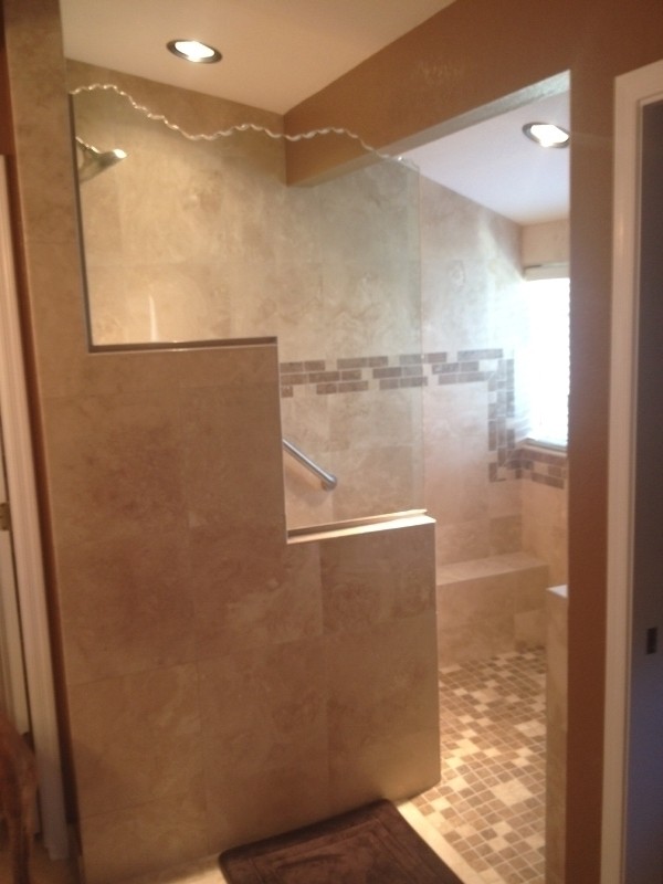 Design ideas for a mid-sized contemporary master bathroom in Phoenix with a corner shower, beige tile, stone tile, beige walls and travertine floors.