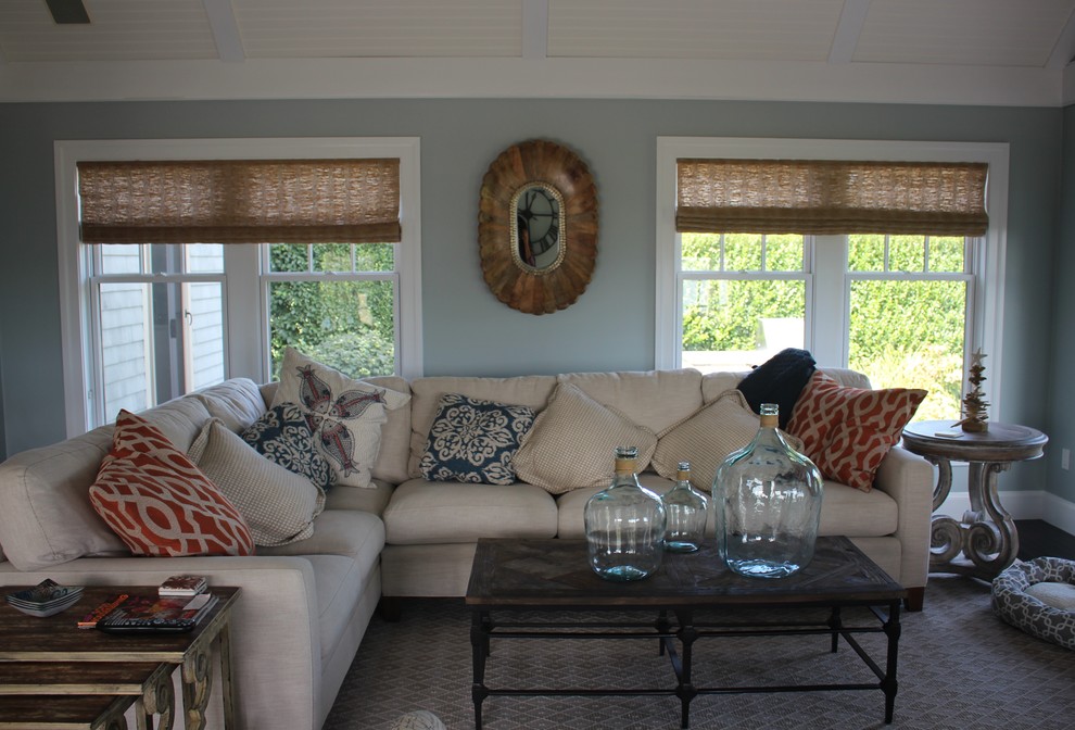 This is an example of a beach style living room in Providence with blue walls.
