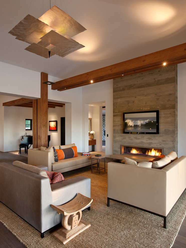 Contemporary open concept living room in Santa Barbara with white walls, a ribbon fireplace and a wall-mounted tv.