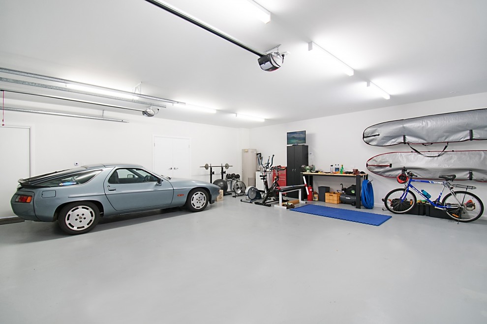 Contemporary three-car garage in Other.