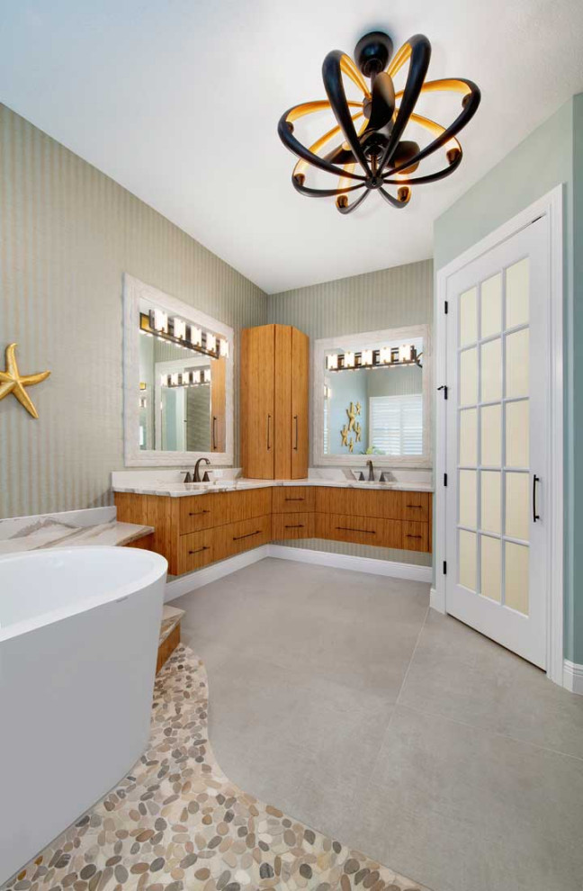 This is an example of a large transitional master bathroom in Miami with flat-panel cabinets, medium wood cabinets, a japanese tub, an open shower, a two-piece toilet, white tile, porcelain tile, multi-coloured walls, porcelain floors, an undermount sink, engineered quartz benchtops, beige floor, multi-coloured benchtops, an enclosed toilet, a double vanity, a floating vanity, wallpaper and an open shower.