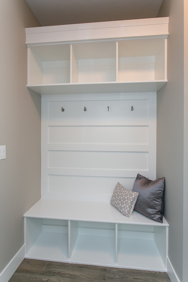 Inspiration for a small transitional medium tone wood floor and gray floor mudroom remodel in Seattle with gray walls