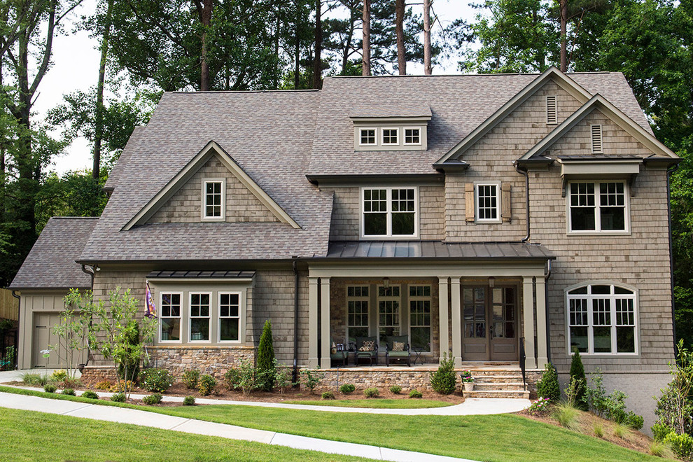 This is an example of a large traditional two-storey brown exterior in Atlanta with mixed siding and a gable roof.