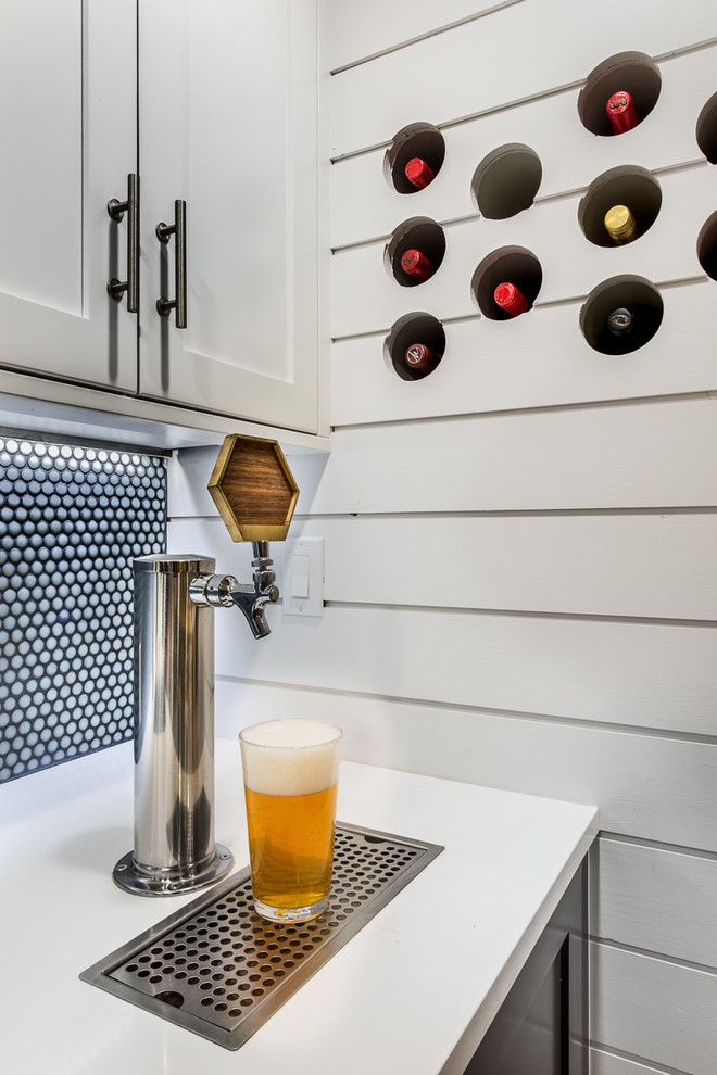 Inspiration for a small transitional home bar in Denver with shaker cabinets and white cabinets.