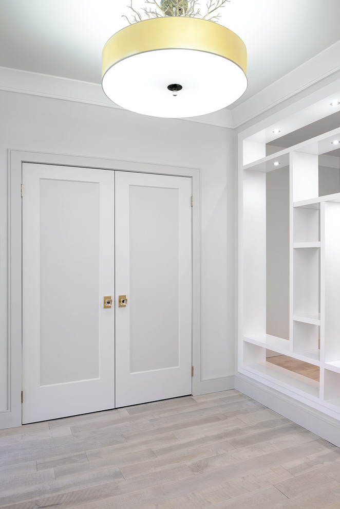 Foyer - mid-sized transitional light wood floor and gray floor foyer idea in Toronto with white walls and a black front door