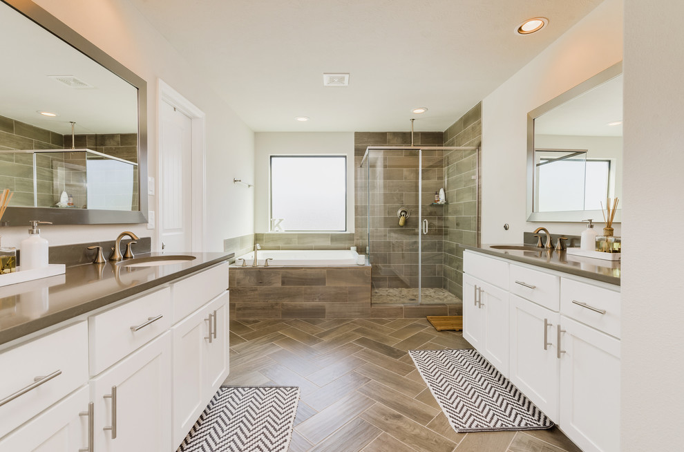 Inspiration for a transitional master bathroom in Houston with shaker cabinets, white cabinets, a drop-in tub, a corner shower, white walls, an undermount sink, beige floor, a hinged shower door and beige benchtops.