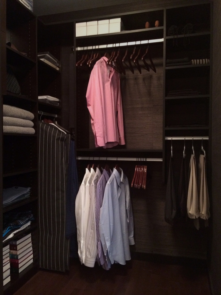 Design ideas for a small contemporary men's walk-in wardrobe in Vancouver with open cabinets, dark wood cabinets and medium hardwood floors.