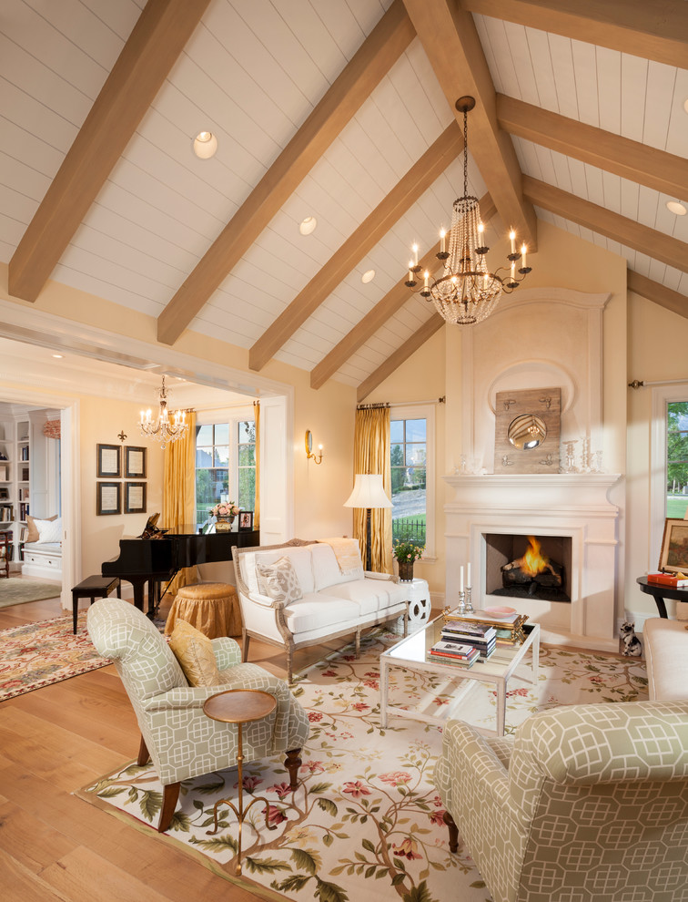 Inspiration for a large traditional enclosed living room in Salt Lake City with a music area, beige walls, a standard fireplace, light hardwood floors, a stone fireplace surround, no tv and brown floor.
