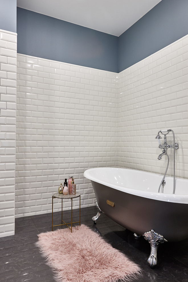 Contemporary master bathroom in Moscow with a claw-foot tub, white tile, subway tile and black floor.