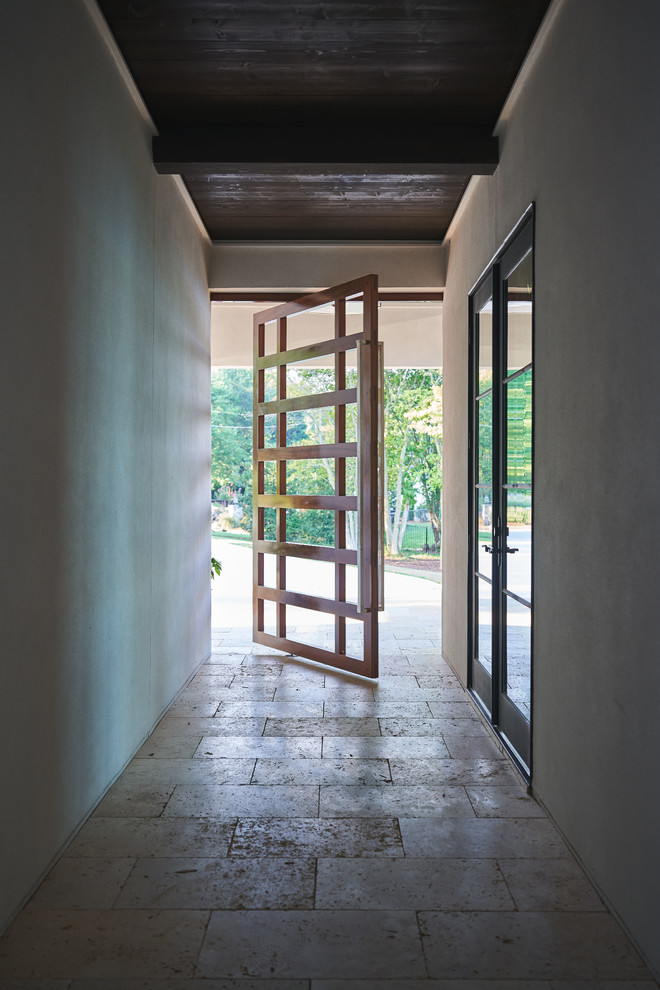 Photo of a midcentury entryway in Charlotte.