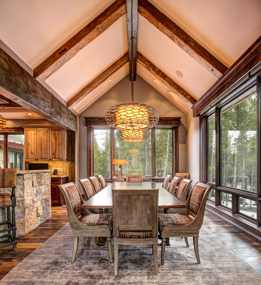 Photo of a country kitchen/dining combo in Denver with dark hardwood floors.