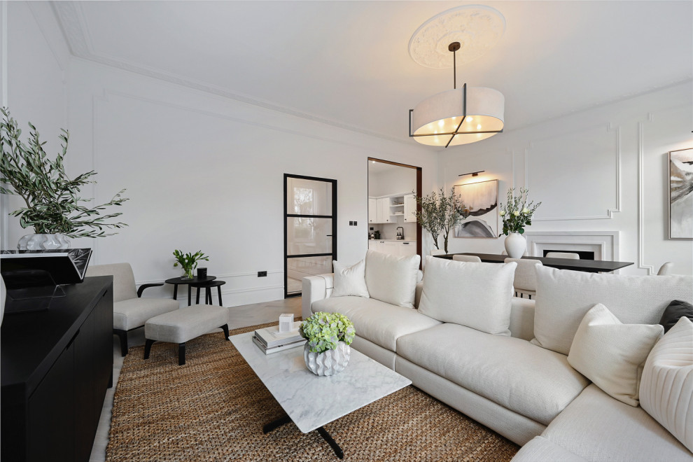 Foto di un soggiorno tradizionale di medie dimensioni con pareti bianche e pannellatura