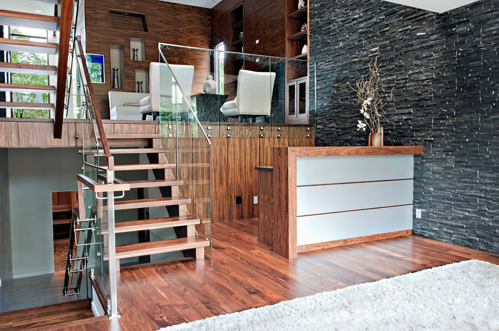 Inspiration for a mid-sized modern wood u-shaped staircase in Toronto with open risers and wood railing.