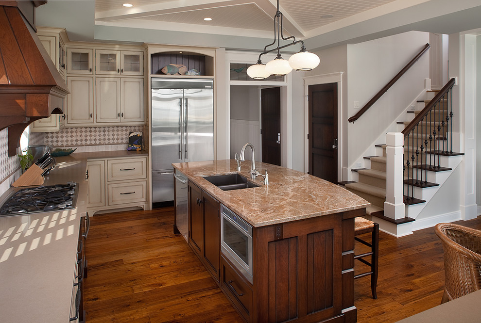 Inspiration for a large traditional u-shaped eat-in kitchen in Grand Rapids with stainless steel appliances, a double-bowl sink, beige cabinets, granite benchtops, multi-coloured splashback, recessed-panel cabinets and with island.