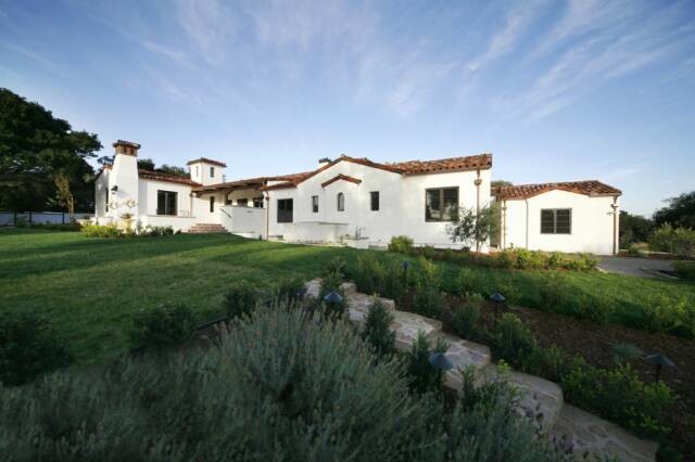 Mid-sized mediterranean one-storey stucco white exterior in Santa Barbara with a gable roof.