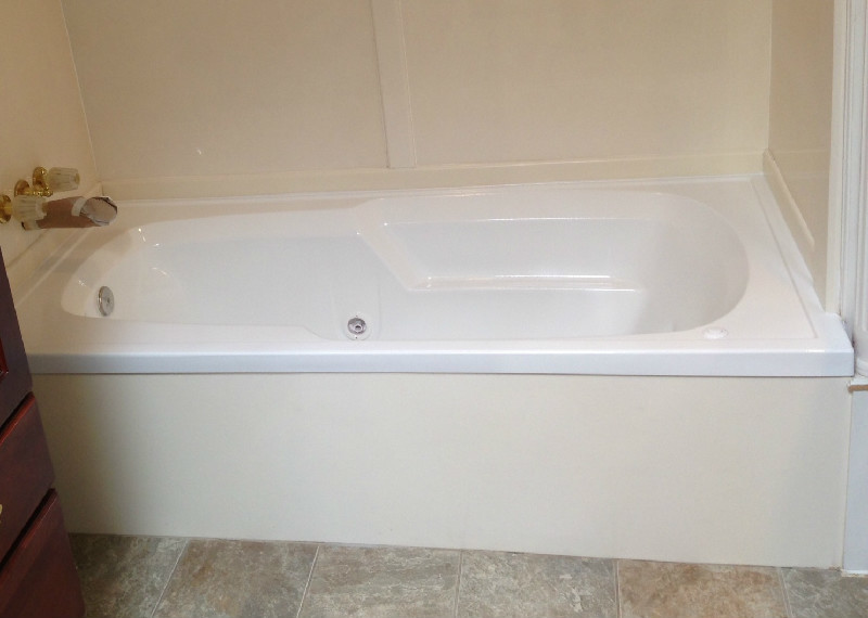 Inspiration for a ceramic tile bathroom remodel in Houston with dark wood cabinets