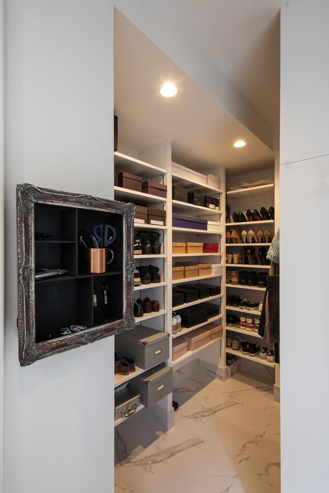 This is an example of a mid-sized modern storage and wardrobe in Other with ceramic floors and white floor.
