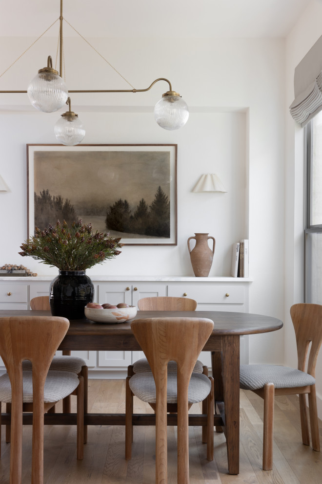 Example of a transitional dining room design in Austin
