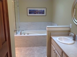 Inspiration for a transitional white tile and porcelain tile home design remodel in Seattle with quartz countertops