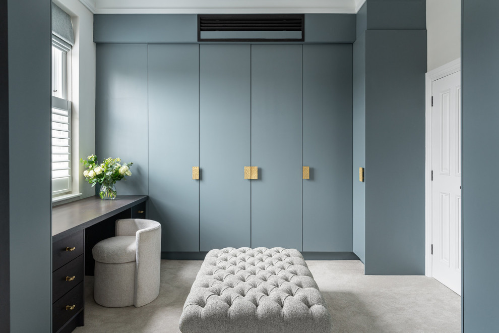 Design ideas for a transitional storage and wardrobe in London.